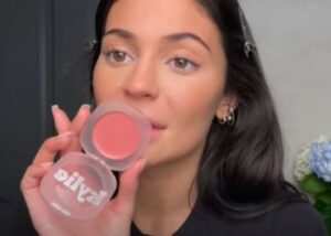 Kylie applying glow balms